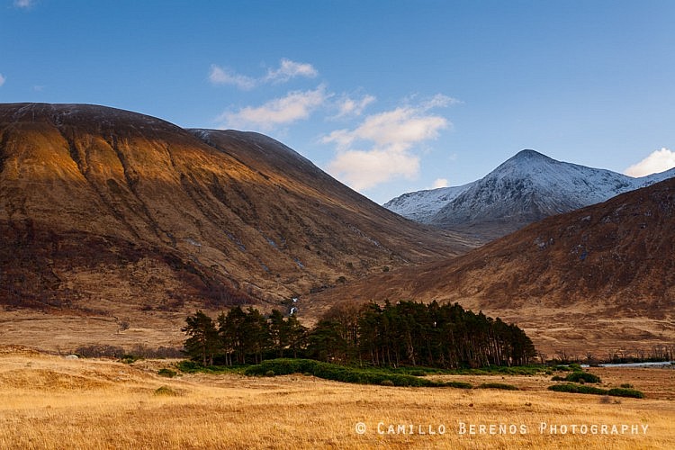 A stripe of light illuminating the mountains on the south side of Glen Etive