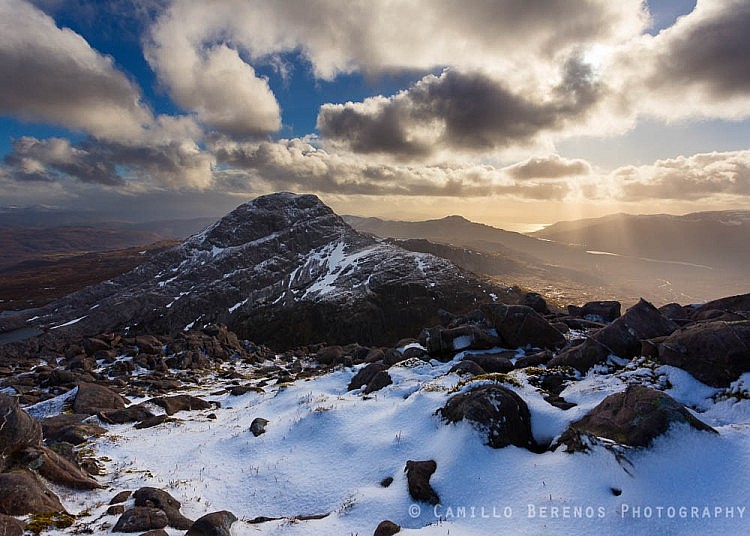 Crepescular rays behind a wintry An Ruadh-stac, Torridon