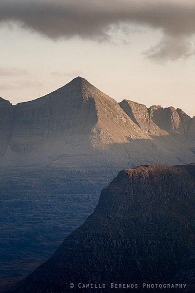 Spidean a' Choire Leith behind Carn na Feola sidelit by soft afternoon light