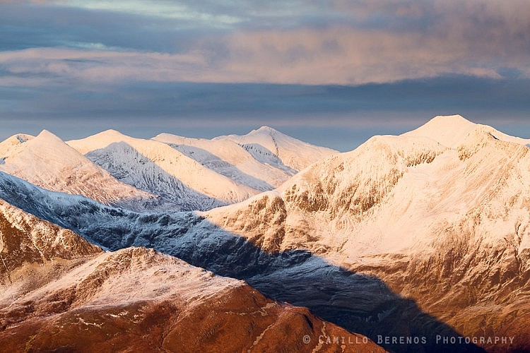 The snow-covered meandering ridge of the Mamore range