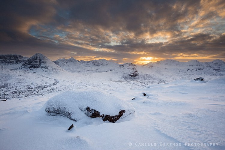 The impressively shaped snowy mountains of Torridon at sunset in winter