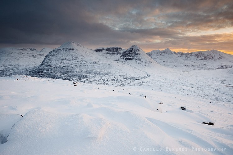 Beinn Eighe and Liathach under a thick snow cover at sunset