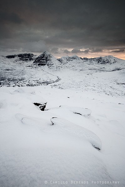 Wintry Beinn Eighe and Liathach seen after heavy snowfall at sunset