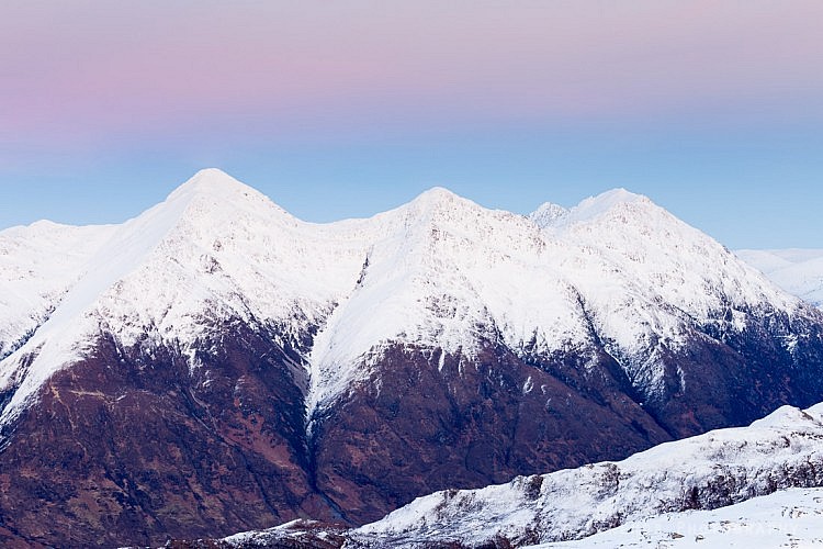 Three of the Five Sisters of Kintail at dusk: Sgurr na Ciste Duibhe,Sgurr na Carnach, and Sgurr Fhuaran