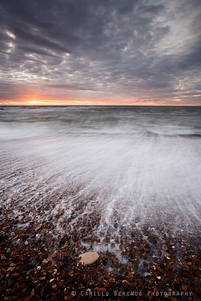 Blurred backwash at the shingle beach at Seaton Sluice, Northumberland