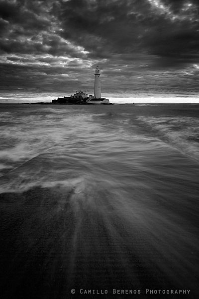 Waves crashing over the causeway to St Mary's lighthouse, Whitley bay